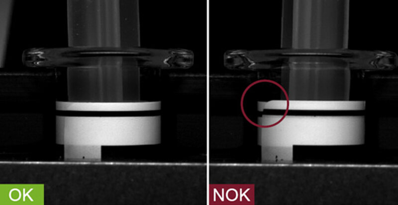 Inspection of label position on a syringe