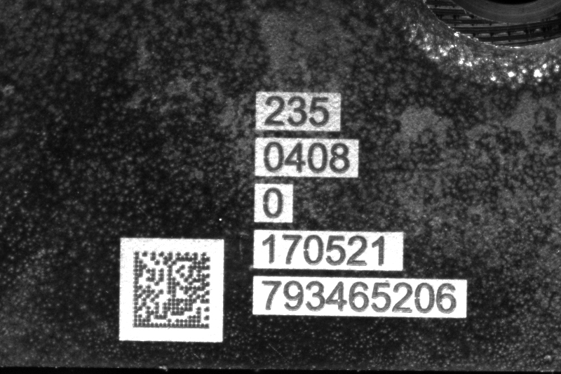 Laser-marked Data Matrix code with human-readable text on a metal component surface